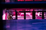 vaporwave style photo of a car behind balcony bars