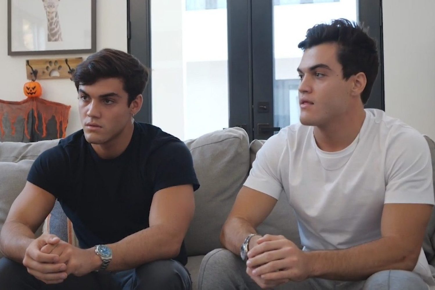 Image of the Dolan twins sitting on a couch