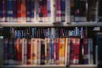 An image of library shelves and the spectacle of literature they represesnt
