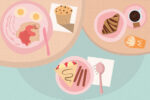 In an article about food essayists A.J. Liebling and M.F.K. Fisher, a pastel table features various pastries including a croissant, pie, muffin, black coffee, and bacon and eggs.